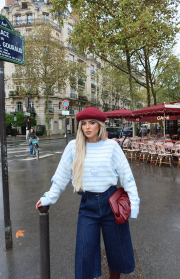 BLUE AND WHITE STRIPED SWEATER WITH DECORATIVE DETAILS