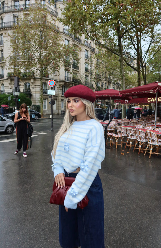 BLUE AND WHITE STRIPED SWEATER WITH DECORATIVE DETAILS
